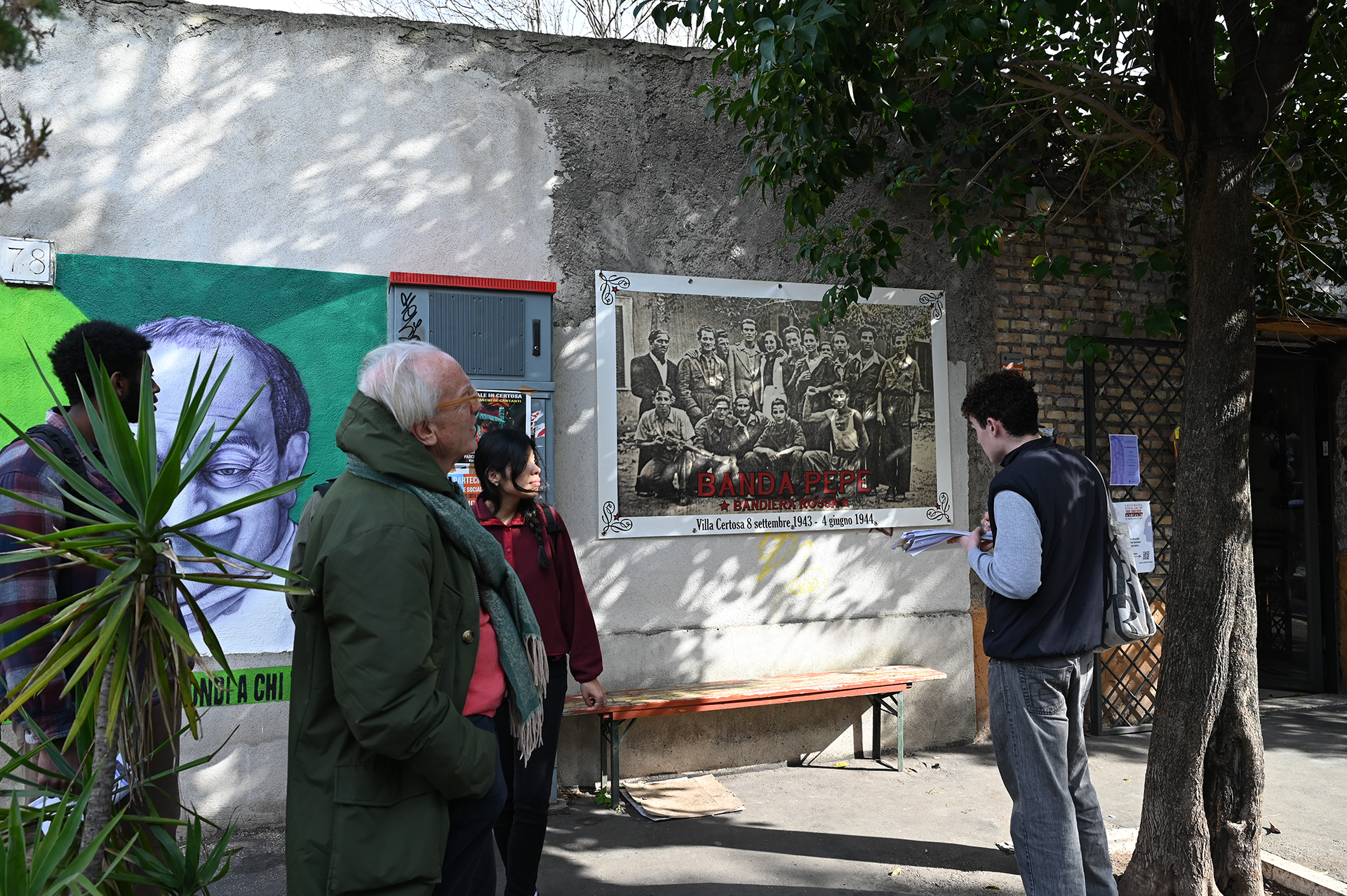 Students on a walking tour of a neighborhood in Rome.